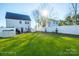 Large backyard with green grass and white fence at 114 E 5Th Ave, Gastonia, NC 28052