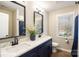 Elegant bathroom with double vanity and quartz countertop at 114 E 5Th Ave, Gastonia, NC 28052