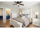 Charming bedroom with a white wooden bed frame and ceiling fan at 114 E 5Th Ave, Gastonia, NC 28052