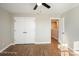 Bright bedroom with double doors and hardwood floors leading to a hallway at 114 E 5Th Ave, Gastonia, NC 28052