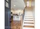 Bright entryway with staircase and view into kitchen at 114 E 5Th Ave, Gastonia, NC 28052