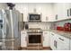 Modern kitchen with stainless steel appliances and white cabinets at 114 E 5Th Ave, Gastonia, NC 28052