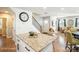 Kitchen island with granite countertop and white cabinets at 114 E 5Th Ave, Gastonia, NC 28052