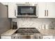 Stainless steel stove and microwave above white shaker cabinets at 114 E 5Th Ave, Gastonia, NC 28052