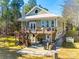 Deck with stairs, patio, and lake view in the background at 1221 Brunson Rd, Fort Lawn, SC 29714