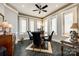 Elegant dining room features a round table and chair set, hardwood floor, and large windows at 1221 Brunson Rd, Fort Lawn, SC 29714