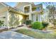 House entrance with a walkway, landscaping, and a lion statue at 1221 Brunson Rd, Fort Lawn, SC 29714