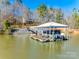 Floating dock with covered seating and boat lift at 1221 Brunson Rd, Fort Lawn, SC 29714