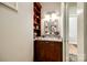 Small powder room with granite vanity and decorative mirror at 1221 Brunson Rd, Fort Lawn, SC 29714