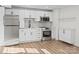 Modern basement kitchen with white cabinets, stainless steel appliances, and tile backsplash at 124 Lyman Oak Ct, Fort Mill, SC 29715