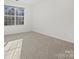 Empty bedroom with carpeted floor and large window at 124 Lyman Oak Ct, Fort Mill, SC 29715