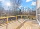 Wooden deck overlooking a wooded backyard with a view to the sunset at 124 Lyman Oak Ct, Fort Mill, SC 29715