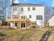 Two-story house with white siding, a deck, and a backyard at 124 Lyman Oak Ct, Fort Mill, SC 29715