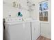 Laundry room with washer, dryer, and overhead shelving at 124 Lyman Oak Ct, Fort Mill, SC 29715