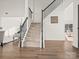 Modern staircase with dark gray railing and carpeted steps at 124 Lyman Oak Ct, Fort Mill, SC 29715