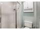 Small bathroom with shower and small cabinet at 129 Bald Cypress Ln, Mooresville, NC 28115