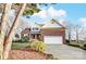 Two-story brick home with a large yard at 129 Bald Cypress Ln, Mooresville, NC 28115