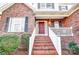 Brick steps leading to a red front door at 129 Bald Cypress Ln, Mooresville, NC 28115