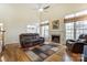 Spacious Gathering room with hardwood floors and fireplace at 129 Bald Cypress Ln, Mooresville, NC 28115