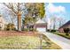 Brick home with a two-car garage and well-maintained landscaping at 129 Bald Cypress Ln, Mooresville, NC 28115