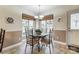 Breakfast nook in kitchen with window and built-in seating at 129 Bald Cypress Ln, Mooresville, NC 28115