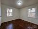 Bedroom with hardwood floors and two windows at 1325 Eastview Ext, Shelby, NC 28152