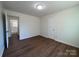 Spacious bedroom with wood flooring, a connecting bathroom and a door for privacy at 1325 Eastview Ext, Shelby, NC 28152