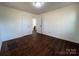 Bright bedroom with dark hardwood floors and spacious closet at 1325 Eastview Ext, Shelby, NC 28152