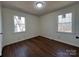 Cozy bedroom with two bright windows providing abundant natural light and wood flooring at 1325 Eastview Ext, Shelby, NC 28152