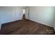 Open bedroom featuring wood flooring, neutral paint and attached bathroom at 1325 Eastview Ext, Shelby, NC 28152