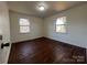 Bedroom with hardwood floors and two windows at 1325 Eastview Ext, Shelby, NC 28152