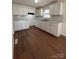 Renovated kitchen, white cabinets, and hardwood floors at 1325 Eastview Ext, Shelby, NC 28152