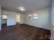 View of living room, kitchen, and hardwood floors at 1325 Eastview Ext, Shelby, NC 28152