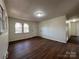 Living room with hardwood floors and access to hallway at 1325 Eastview Ext, Shelby, NC 28152