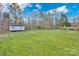 Large grassy backyard with detached shed at 13833 Jonathans Ridge Rd, Mint Hill, NC 28227