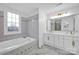 Bathroom with double vanity and soaking tub at 13833 Jonathans Ridge Rd, Mint Hill, NC 28227