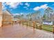 Spacious deck with wood railings, offering backyard views at 13833 Jonathans Ridge Rd, Mint Hill, NC 28227