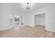 Bright dining room with bay window, hardwood floors, and white wainscoting at 13833 Jonathans Ridge Rd, Charlotte, NC 28227