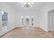 Bright dining room with bay window, hardwood floors, and white wainscoting at 13833 Jonathans Ridge Rd, Charlotte, NC 28227