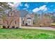 Brick house with a two-car garage and a well-manicured lawn at 13833 Jonathans Ridge Rd, Mint Hill, NC 28227