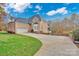 Brick house with attached garage and driveway at 13833 Jonathans Ridge Rd, Charlotte, NC 28227