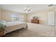 Spacious Primary bedroom with window and carpet at 1411 Ladora Dr, Charlotte, NC 28262