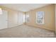 Simple bedroom with two windows and carpet at 1411 Ladora Dr, Charlotte, NC 28262