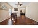 Spacious dining area with hardwood floors and an adjacent living room at 1411 Ladora Dr, Charlotte, NC 28262