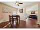 Dining area with hardwood floors, a table and chairs, and a ceiling fan at 1411 Ladora Dr, Charlotte, NC 28262