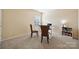 Well-lit home office featuring a desk, chairs, and a bookshelf at 1411 Ladora Dr, Charlotte, NC 28262