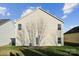 Two-story house with vinyl siding and a small patio at 1411 Ladora Dr, Charlotte, NC 28262