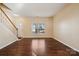 Spacious living room featuring hardwood floors and a large window at 1411 Ladora Dr, Charlotte, NC 28262