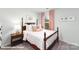 Bright bedroom with a full-size bed, nightstand, and ample closet space at 1424 6Th Ne St, Hickory, NC 28601