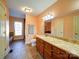 Bathroom boasts a large vanity with granite countertop and tile flooring at 148 Tetbury Ne Ave, Concord, NC 28025